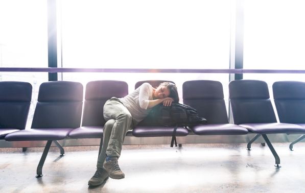 Holiday travel jetlag, delayed flights, skipping timezones, travel wellness tips, sleeping in airports